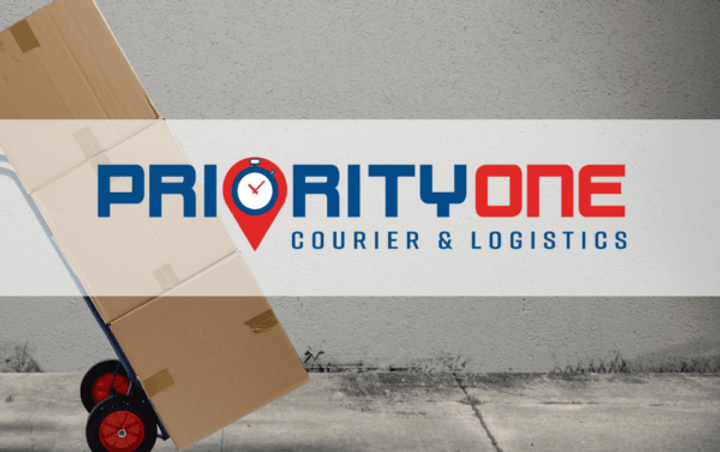 A person holding boxes in front of a sign that reads " priority one courier & logistic ".